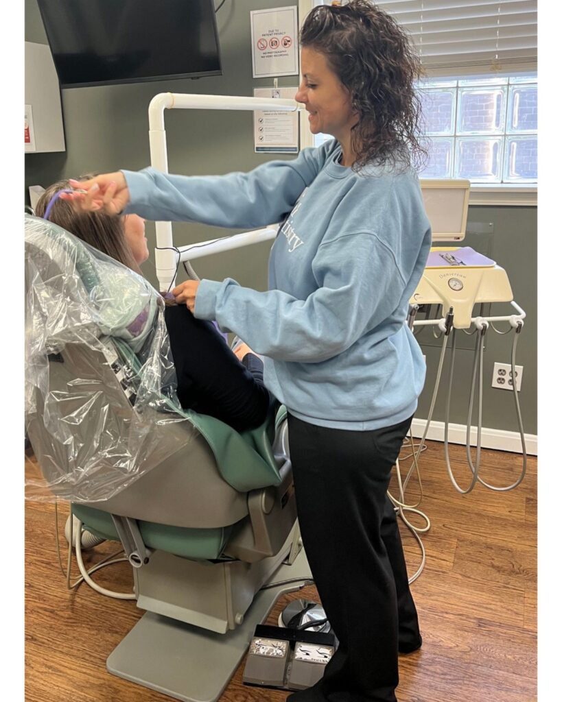 Dental assistant making a patient comfortable at Total Dentistry in Cincinnati